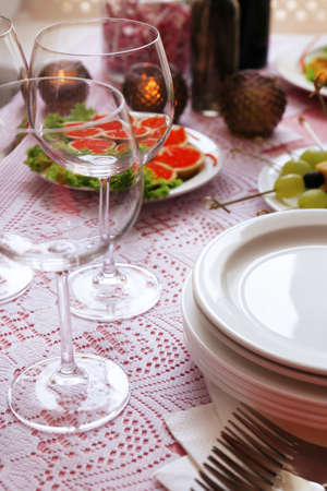Buffet table with dishware waiting for guestsの写真素材