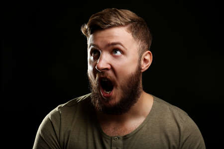 Portrait of handsome man with beard on black backgroundの写真素材