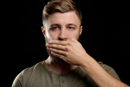 Portrait of handsome man with beard on black backgroundの写真素材