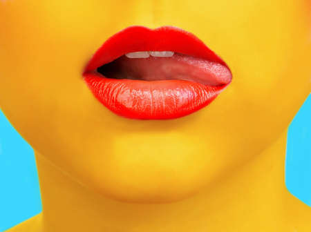 Close-up portrait of girl with yellow skin and red lipsの写真素材