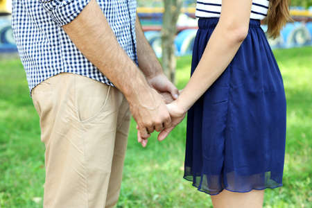 Loving couple holding hands outdoorsの写真素材