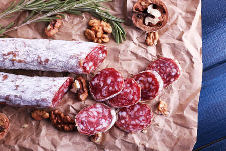 French salami and walnuts on craft paper backgroundの写真素材