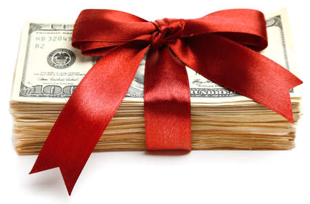 Bundle of dollars tied with ribbon isolated on whiteの写真素材