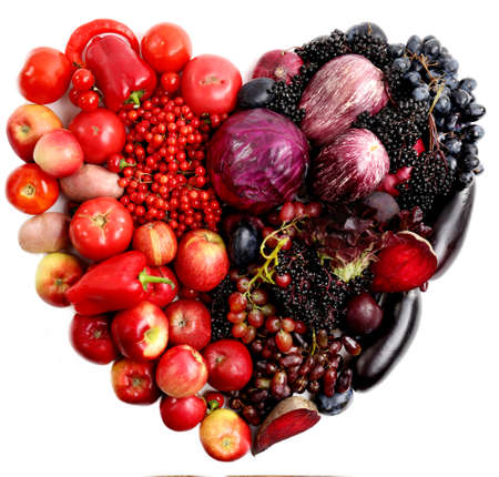 Fresh organic vegetables in shape of heart, isolated on whiteの写真素材