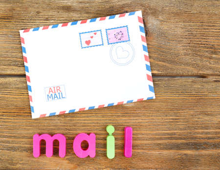 Mail word formed with colorful letters on wooden backgroundの写真素材