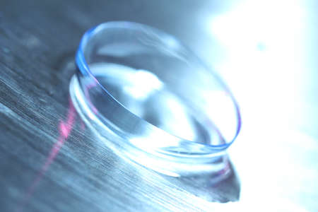 Contact lens with water drops on bright backgroundの写真素材