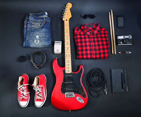 Music equipment, clothes and footwear on black backgroundの写真素材