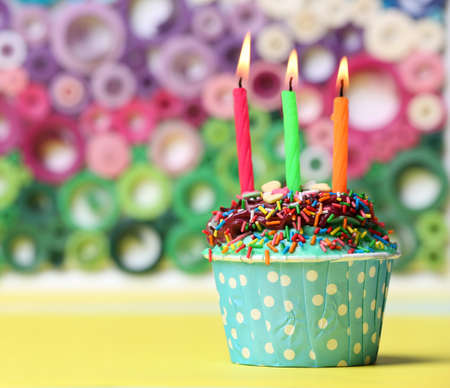 Delicious birthday cupcake on bright の写真素材