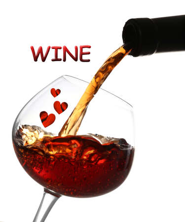 Red wine pouring into glass, isolated on whiteの写真素材