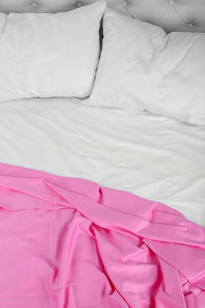 Crumpled pink linen on bedの写真素材