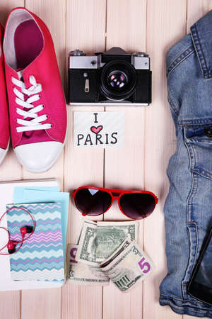 Travel things for traveling on wooden background top viewの写真素材