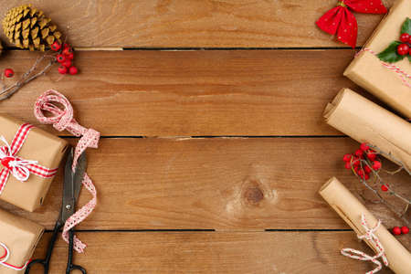 Beautiful Christmas composition with handmade gifts on wooden の写真素材