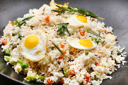 Tasty rice preparing in wok, close-upの写真素材