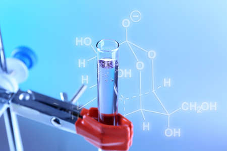 Fixed test tube on support on light blue backgroundの写真素材
