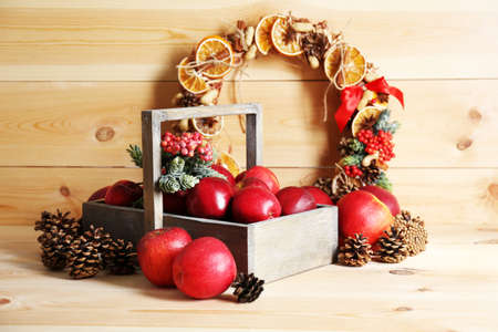 Christmas apples on wooden tableの写真素材