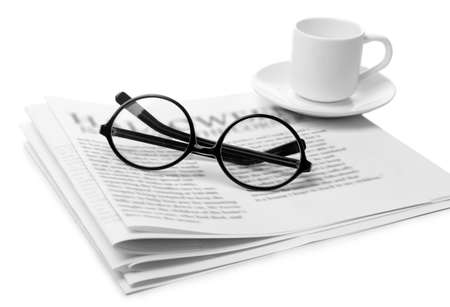 Glasses and newspapers, isolated on whiteの写真素材