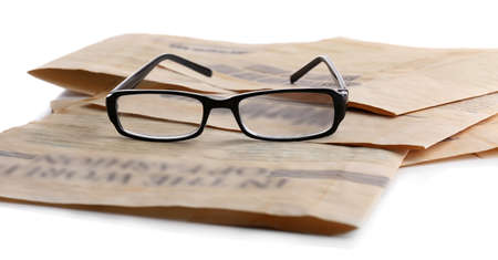 Glasses and newspapers, close-upの写真素材