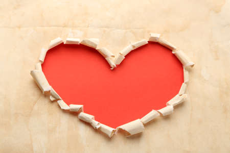 Paper heart over red backgroundの写真素材