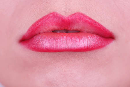 Applying lipstick on lips, macroの写真素材