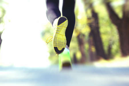 Runner feet on road, outdoorsの写真素材