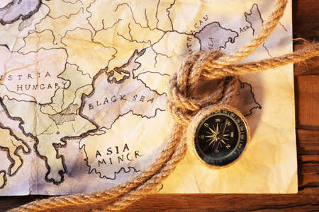 Marine still life with world map and rope on wooden table backgroundの写真素材