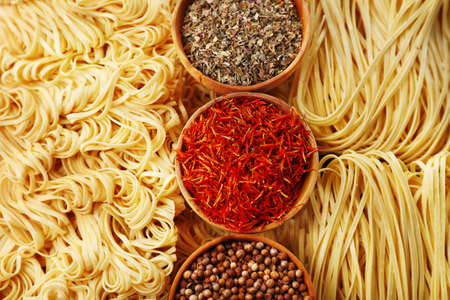 Different dry instant noodles with spices close-upの写真素材