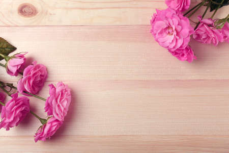 Beautiful roses on wooden table backgroundの写真素材