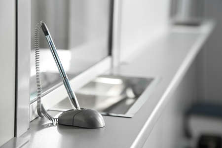 Pen on surface near cash department window Pen on surface near cash department window
