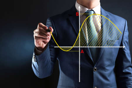 Businessman hand writing a business graphの写真素材