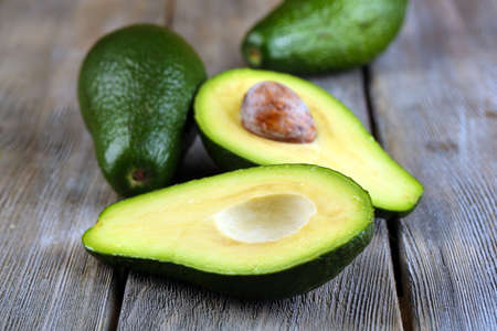 Avocado on wooden の写真素材