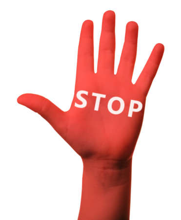 Red child hand with word STOP isolated on whiteの写真素材