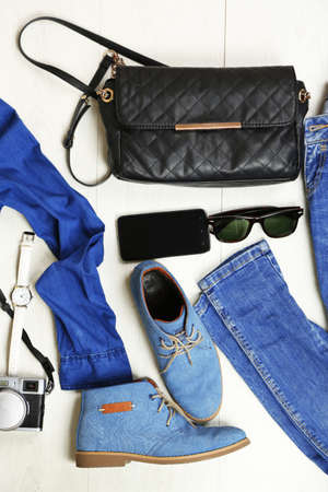 Still life of casual woman. Woman clothes and accessories on wooden backgroundの写真素材
