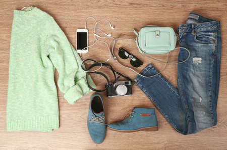 Still life of casual woman. Woman clothes and accessories on wooden backgroundの写真素材