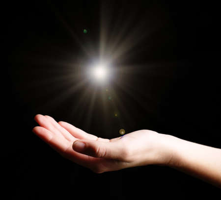 The light in young woman handの写真素材
