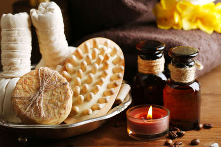Composition of spa treatment on wooden table, on dark color backgroundの写真素材