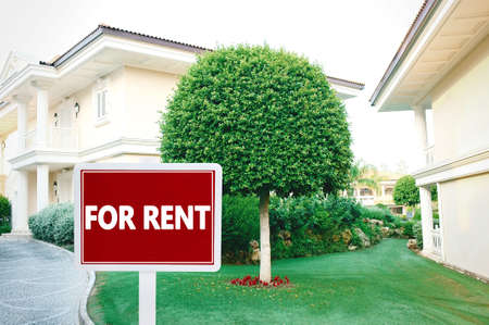 Real estate sign in front of new house for rentの写真素材