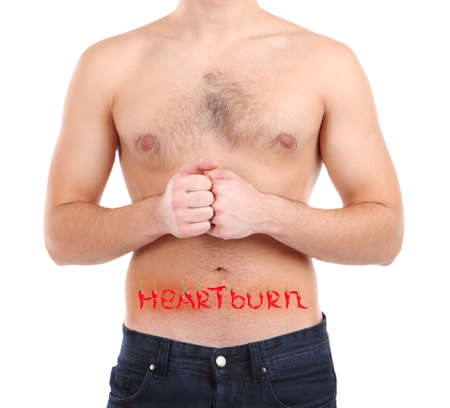 Word Heartburn made with red hot peppers on man's body, Heartburn conceptの写真素材