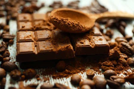 Still life with chocolate, grains and cocoa on wooden backgroundの写真素材