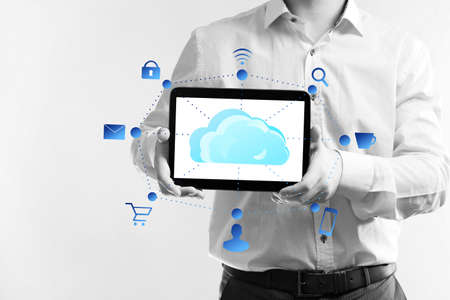 Businessman with  cloud computing diagram on tablet-pc, modern technology conceptの写真素材