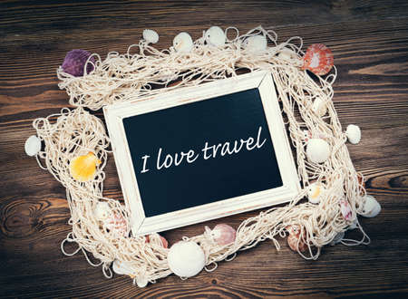 Travel inscription on wooden backgroundの写真素材