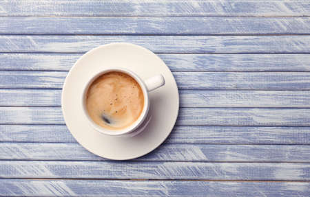 Cup of coffee on wooden table, top viewの写真素材