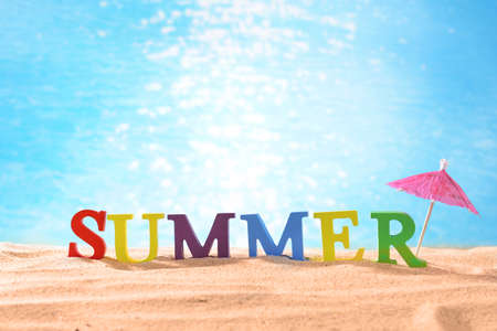 Word summer on beach sandの写真素材