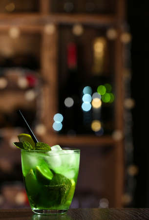 Glass of cocktail on bar backgroundの写真素材