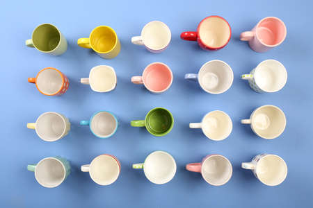 Group of colorful cups on color table, top viewの写真素材