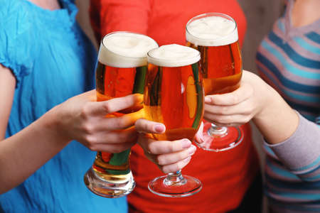 Beer in female hands, closeupの写真素材