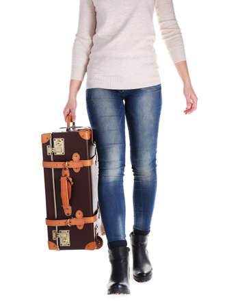 Woman with suitcase isolated on whiteの写真素材