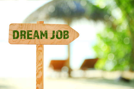 Dream job concept. Wooden sign board on nature backgroundの写真素材