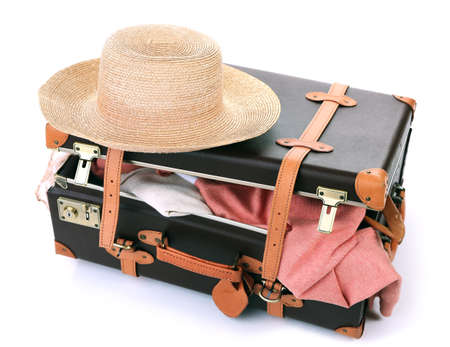 Packing suitcase for trip isolated on whiteの写真素材