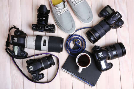 Still life with modern cameras on wooden table, top viewの写真素材