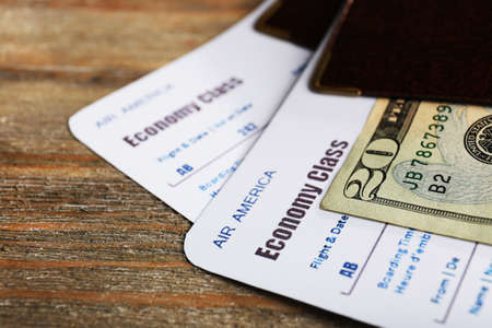 Airline tickets and documents on wooden table, closeupの写真素材